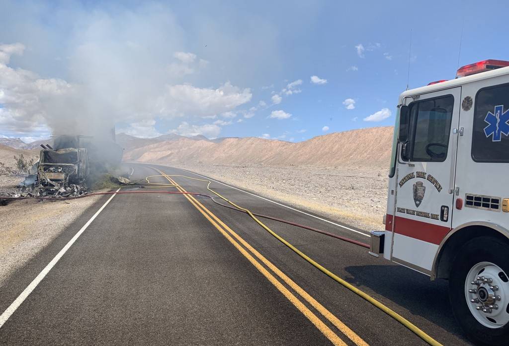 A hay truck burns in Death Valley National Park after the driver took a wrong turn and drove do ...