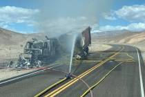 A hay truck burns in Death Valley National Park after the driver took a wrong turn and drove do ...