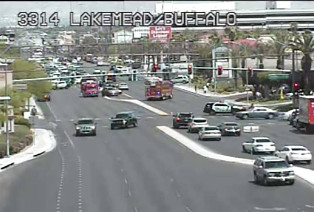 Las Vegas police investigate a crash at West Lake Mead Boulevard and North Buffalo Drive, Frida ...