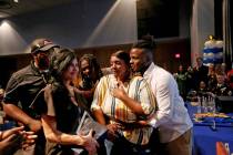 Bryan LaGrange hugs his mom Tyria Smith as she reacts to the news that she will receive a new c ...