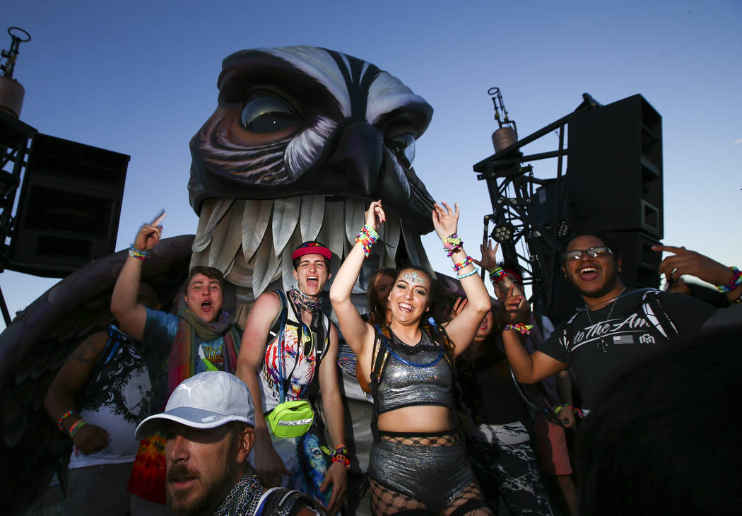 Attendees dance at the Wide Awake art car during the first day of the Electric Daisy Carnival a ...