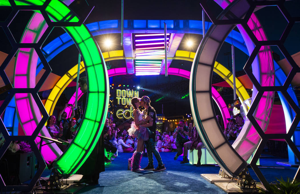 Jessye Tolmich, left, and Dakota Tolmich, both of Denver, kiss during their wedding ceremony on ...