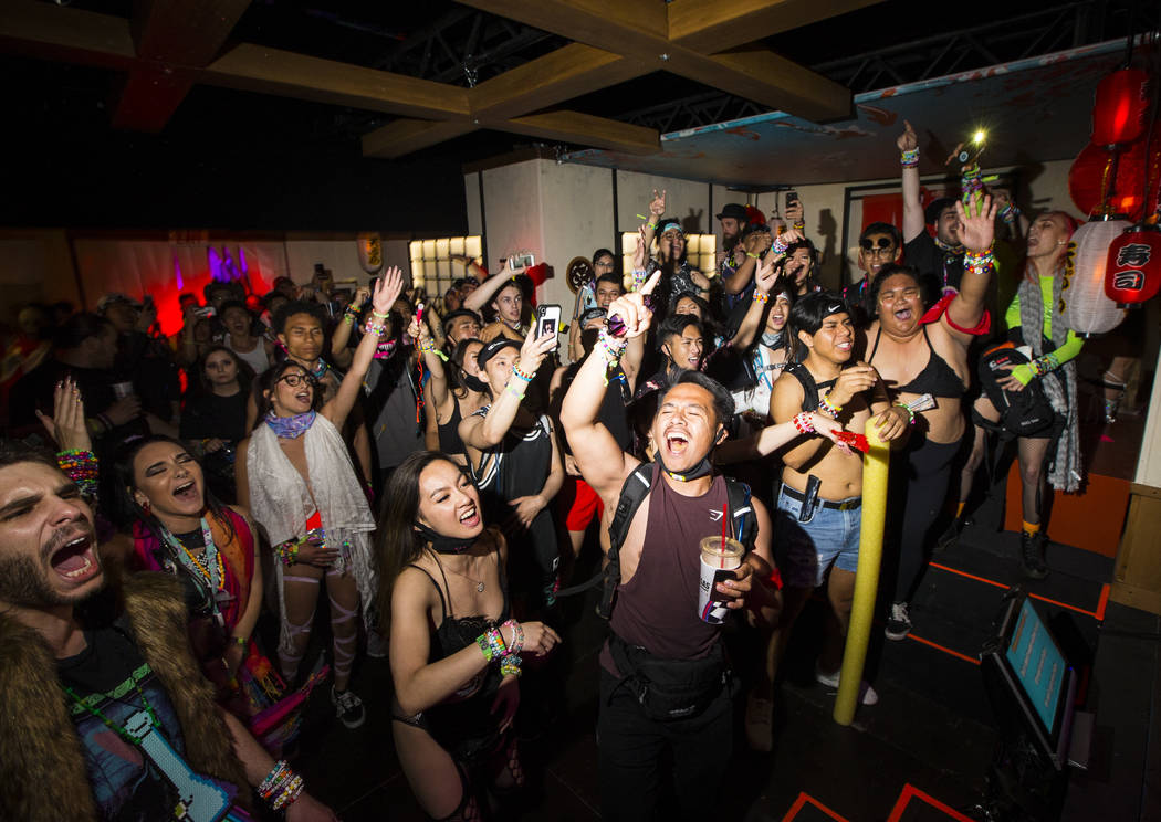 Attendees relax by the Tokyo Karaoke Bar during the second day of the Electric Daisy Carnival a …