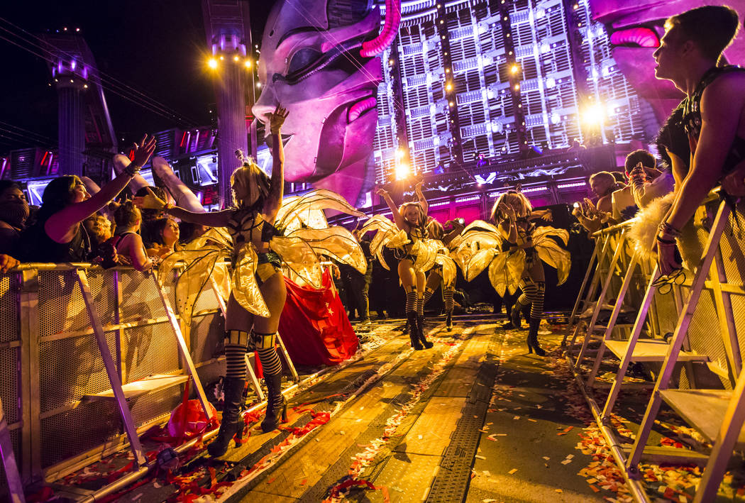 Costumed performers entertain attendees as Excision performs at the Kinetic Field stage during ...