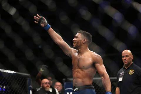 Kevin Lee celebrates his win over Edson Barboza after their fight was stopped in the fourth rou ...