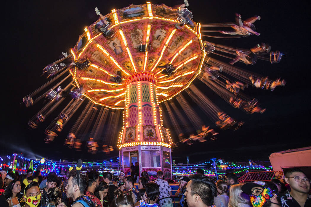 Attendees relax by the Tokyo Karaoke Bar during the second day of the Electric Daisy Carnival a …
