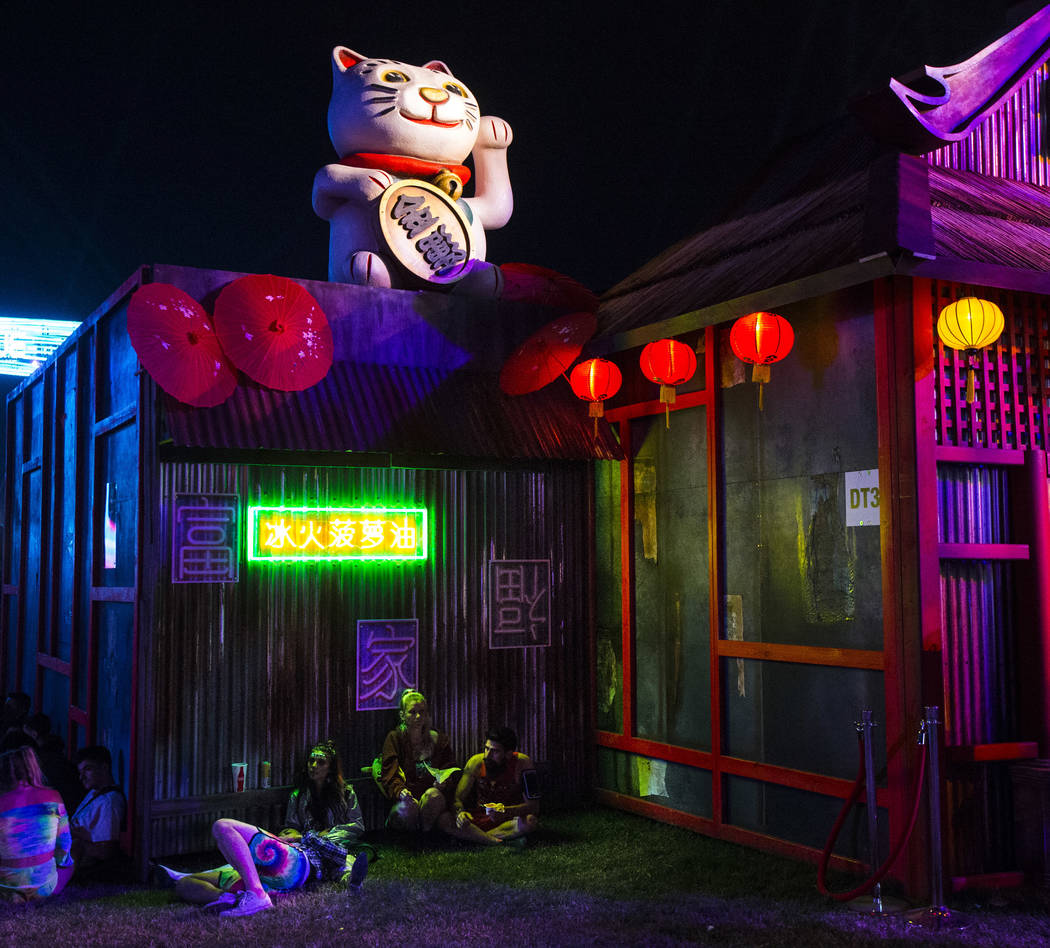 Attendees relax by the Tokyo Karaoke Bar during the second day of the  Electric Daisy Carnival a …