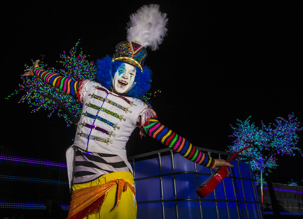 A member of the EDC Clown Marching Band dances outside Pixel Forest on day three of Electric Da ...