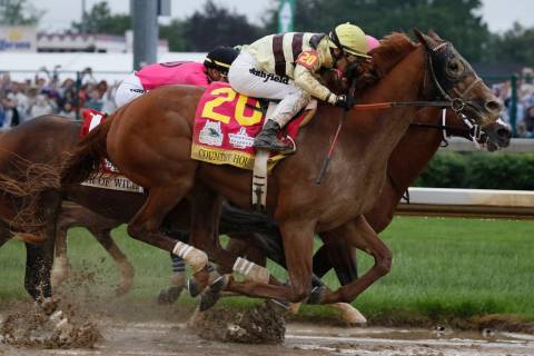 Flavien Prat rides Country House to victory during the 145th running of the Kentucky Derby hors ...
