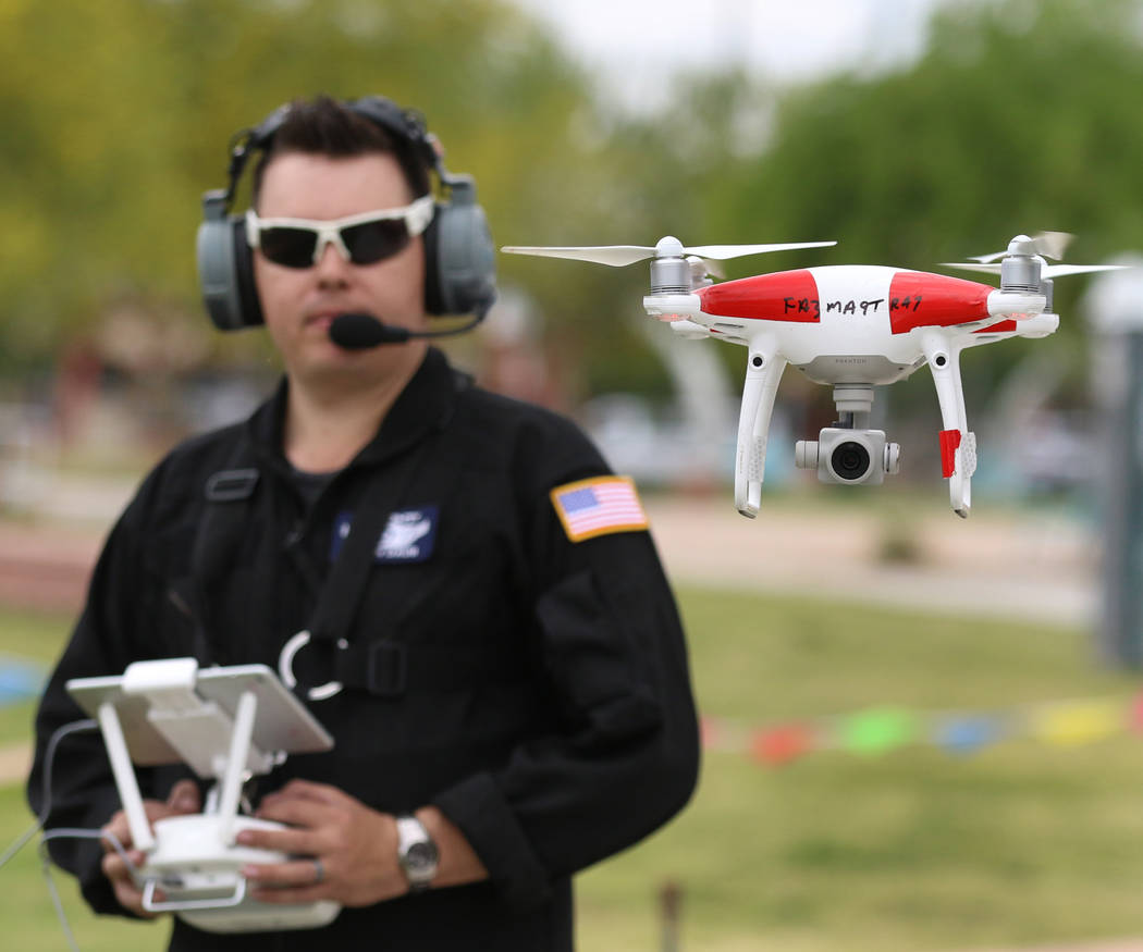 Jason Daub, a pilot in command, flies his Phantom IV drone over Craig Ranch Park on Friday, May ...