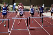 Quincy Bonds of Centennial, second from left, on her way to winning Class 4A 300 meter hurdles ...