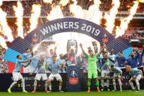 Manchester City players celebrate after winning the English FA Cup Final soccer match between M ...