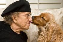 Comedian Sammy Shore gets a lick on the nose from his dog Tallulah in his home in Las Vegas, Fr ...