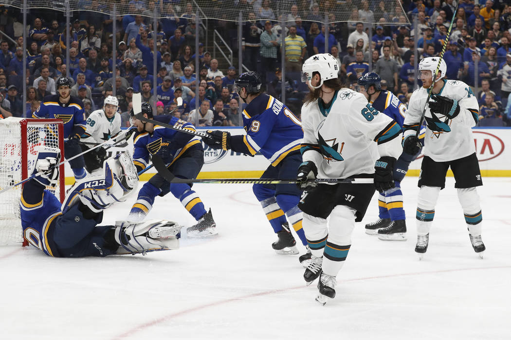 San Jose Sharks defenseman Erik Karlsson (65), of Sweden, scores the winning goal past St. Loui ...