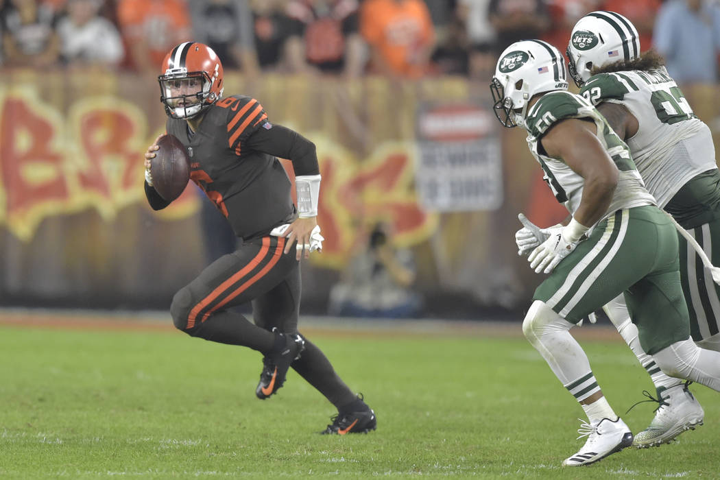 Cleveland Browns quarterback Baker Mayfield looks to pass during an NFL football game against t ...