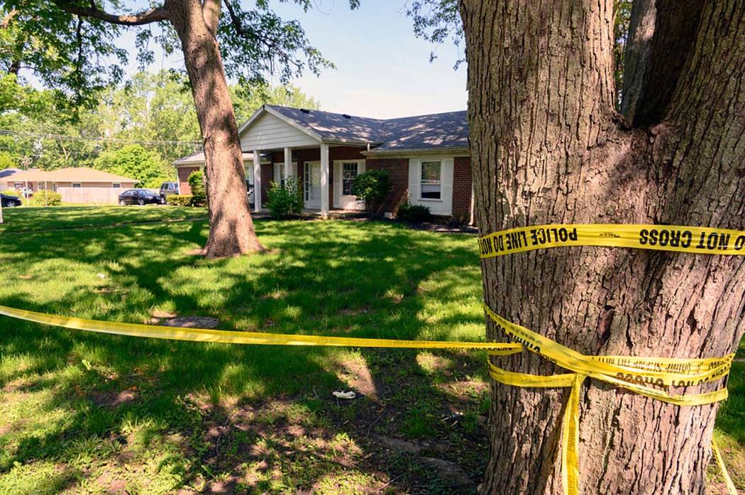 Police continue to investigate the scene of a shooting, Saturday, May 18, 2019 in Muncie, Ind. ...