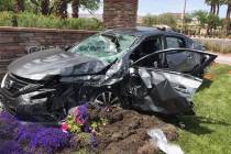 A car is seen at the site of a fatal crash at West Charleston Boulevard and South Town Center D ...
