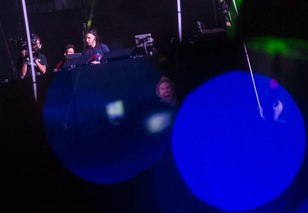 Skrillex performs during a surprise set at the Circuit Grounds stage during the second day of t ...