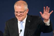Australian Prime Minister Scott Morrison speaks to party supporters after his opponent concedes ...
