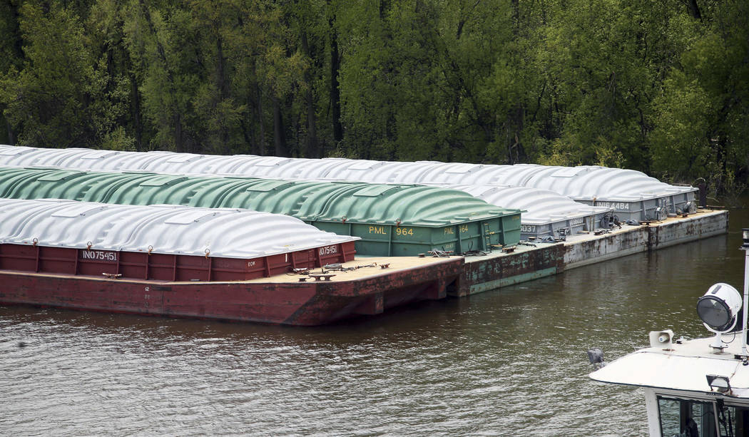 In this Tuesday, May 14, 2019 photo, barges already loaded with soy beans, potash or scrap stee ...