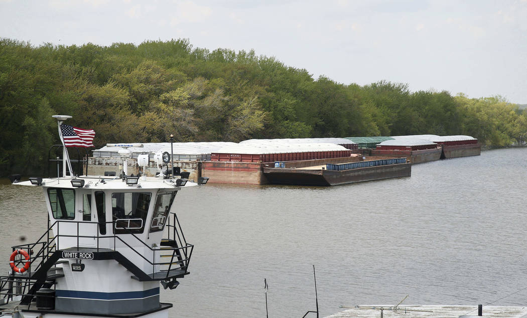 In this Tuesday, May 14, 2019 photo, empty barges are moored on the Mississippi River in St. Pa ...