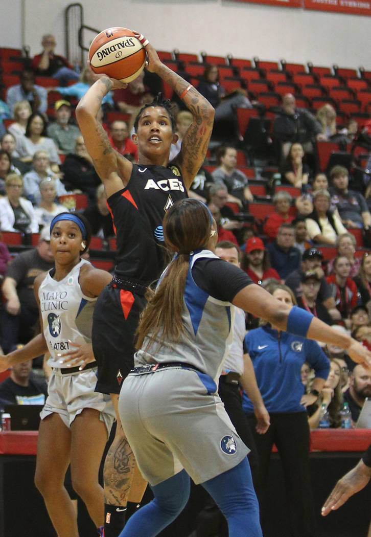 Las Vegas Aces Tamara Young (1) attempts a basket against Minnesota Lynx Odyssey Sims (1) at Co ...