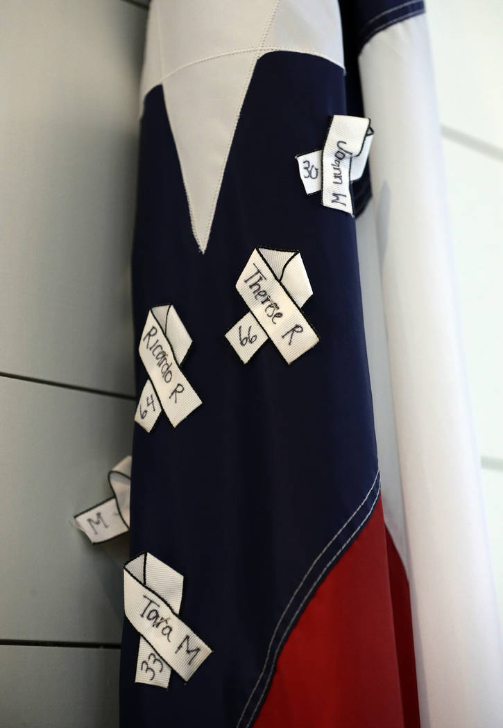 The names of victims hang on a Texas flag during a dedication ceremony for a new sanctuary and ...