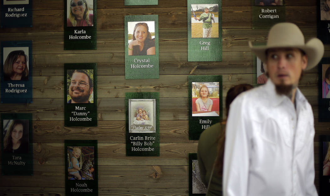 Churchgoers pass a memorial wall following a dedication ceremony for a new sanctuary and memori ...