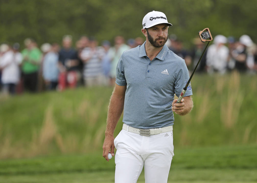 Dustin Johnson walks off the 12th green during the final round of the PGA Championship golf tou ...