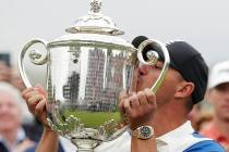Brooks Koepka kisses the Wanamaker trophy after winning the PGA Championship golf tournament, S ...