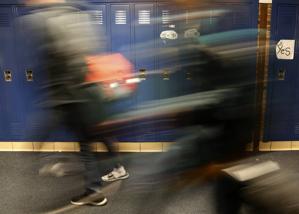 Students walk through a hallway at Cadillac High School in Cadillac, Mich., on Wednesday, April ...