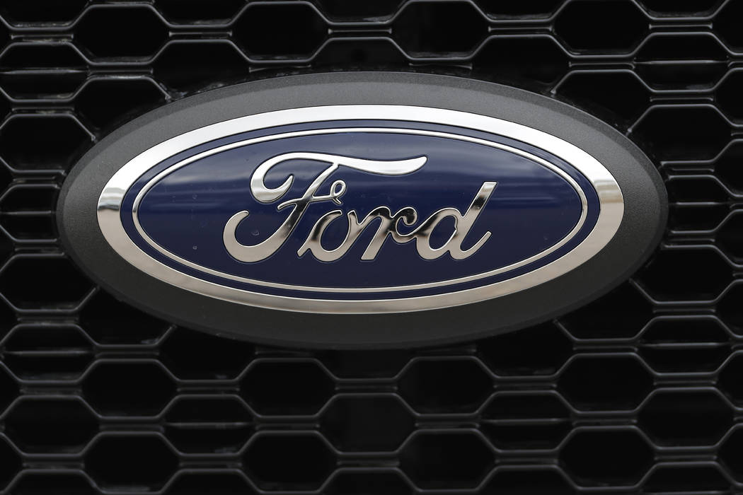 In this Feb. 17, 2019, file photo the company logo is displayed on the grille of an unsold 2019 ...