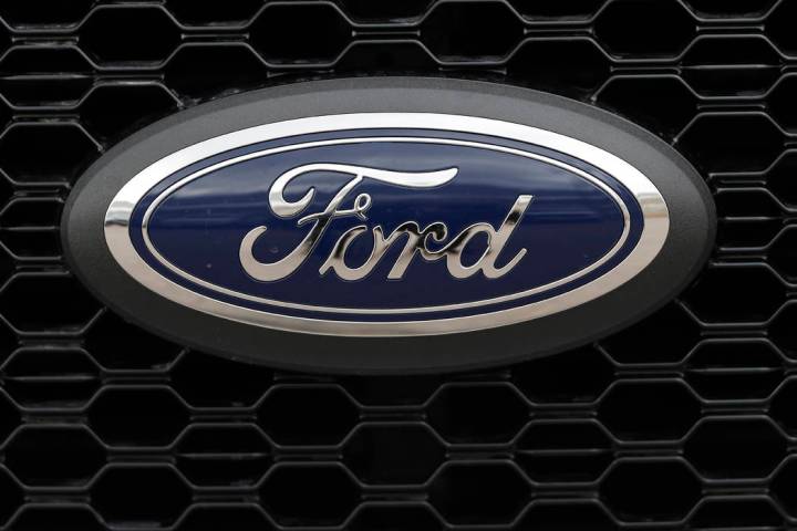 In this Feb. 17, 2019, file photo the company logo is displayed on the grille of an unsold 2019 ...