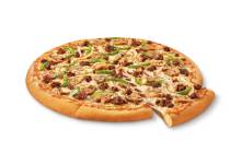 This undated image provided by Little Caesars shows the Impossible Supreme pizza. Plant-based b ...
