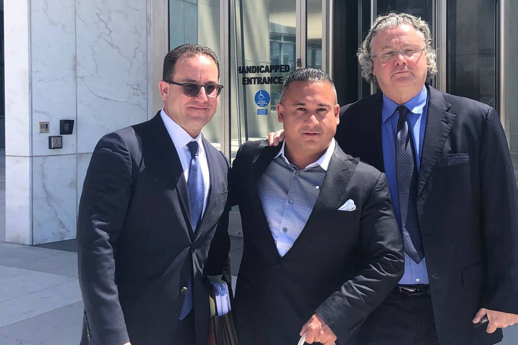 David Oancea, known in sports betting circles as Vegas Dave, center, stands with attorneys Rich ...