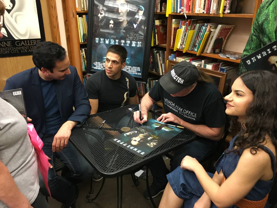 Meeting "Unwritten" fans are actor Gabriel Burrafato, seated far left, composer Ricardo Gerhard ...