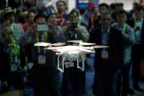 A drone hovers at the DJI booth during CES International in Las Vegas on Jan. 7, 2016. In Utah, ...