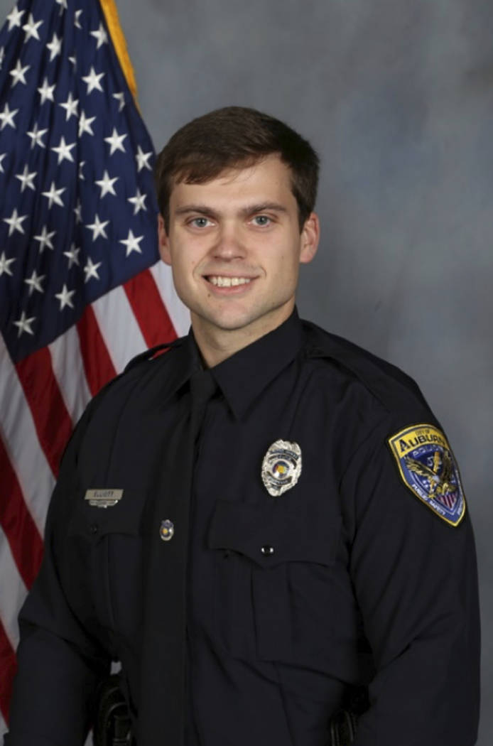 This undated photo provided by the Auburn Police Department shows Officer Evan Elliott, who was ...