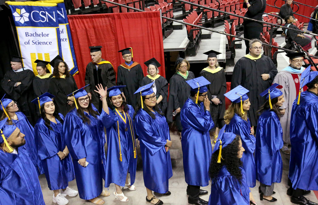 Graduates walk in the processional during College of Southern Nevada commencement ceremony at T ...