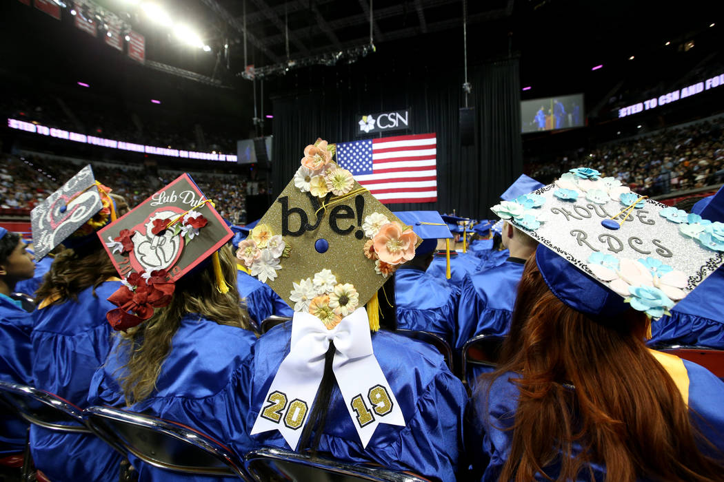 Graduates don personalized mortarboards during College of Southern Nevada commencement ceremony ...