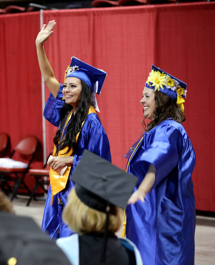 Tracey Jackson, left, and Stef Martin wave to their families during College of Southern Nevada ...