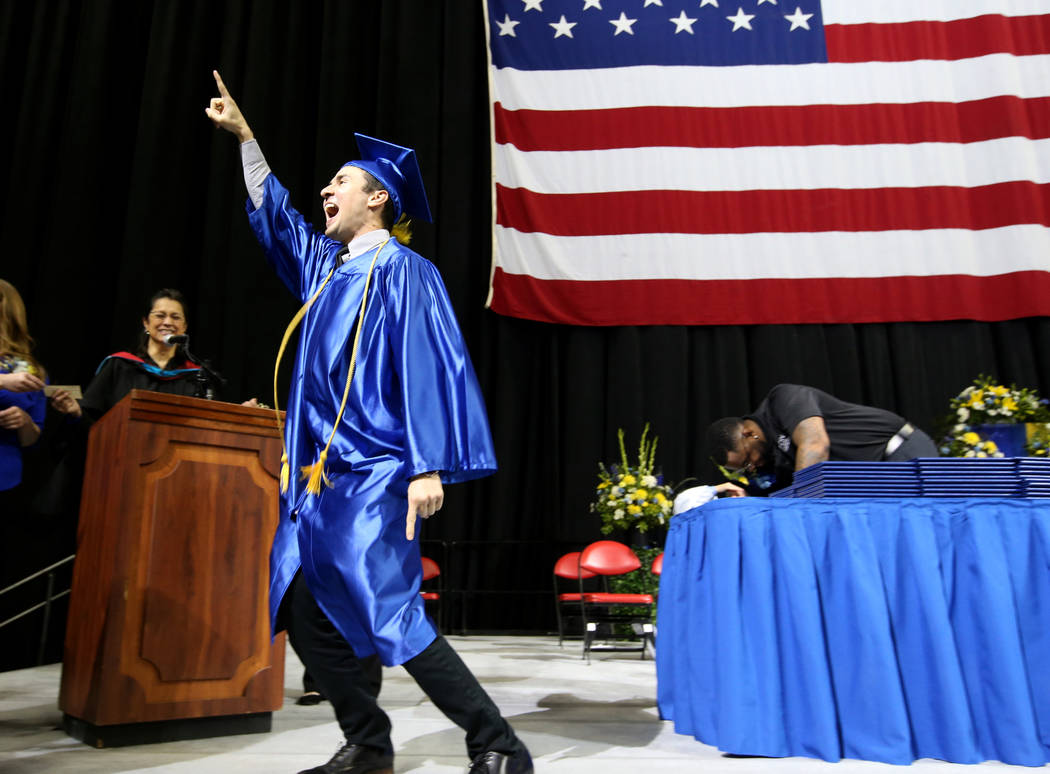 Miguel Nunez walks across the stage during College of Southern Nevada commencement ceremony at ...