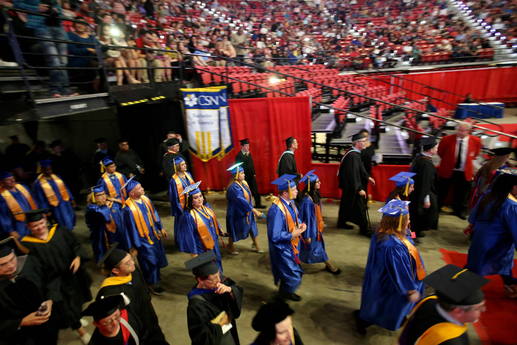 Graduates walk in the processional during College of Southern Nevada commencement ceremony at T ...