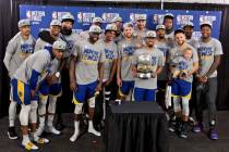 The Golden State Warriors players pose with the Western Conference Championship trophy after Ga ...