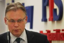 Poland's ruling party lawmaker Arkadiusz Mularczyk talks to The Associated Press in the parliam ...