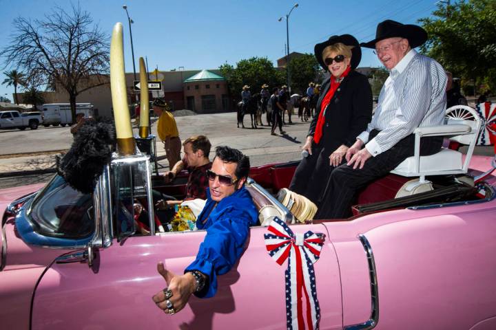 Elvis impersonator Jesse Garon, left, poses for a photographer with Mayor Carolyn Goodman, cent ...