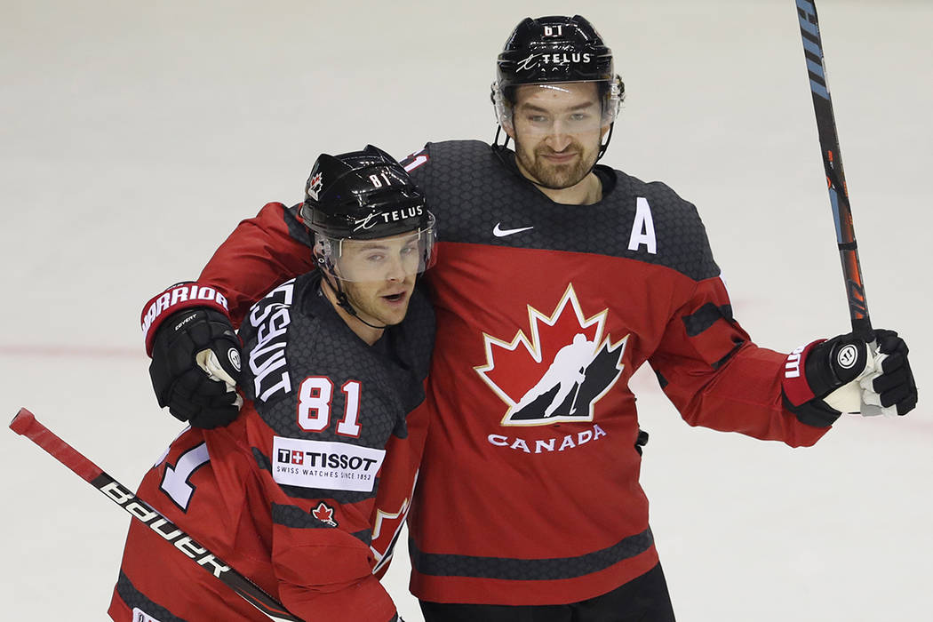 Canada's Mark Stone, right, celebrates with Canada's Jonathan Marchessault, left, after scoring ...