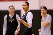 Aces center Liz Cambage, center, with forward Carolyn Swords, left, and center JiSu Park during ...