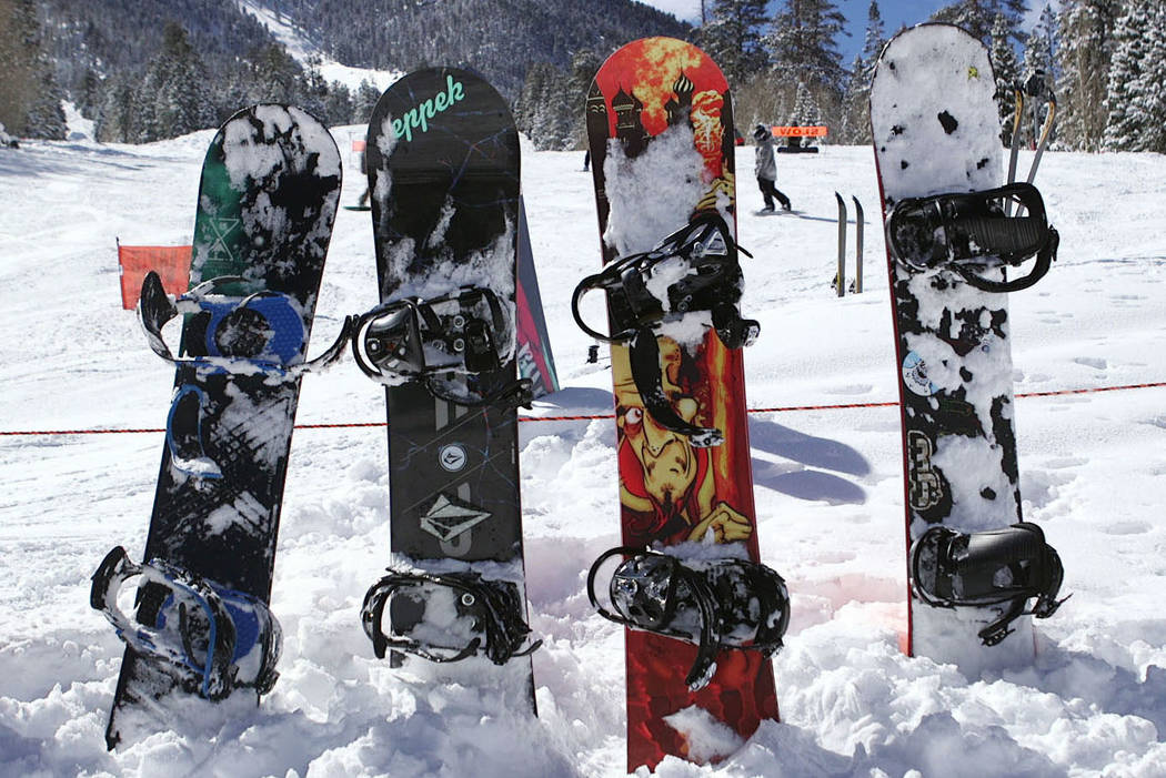 Snowboards stick up from the fresh snow at Lee Canyon outside Las Vegas on Monday, Feb. 18, 201 ...