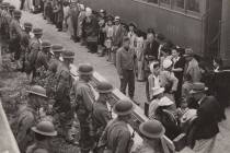 People wait for a train to take them to internment camps in this undated photo. (Courtesy)